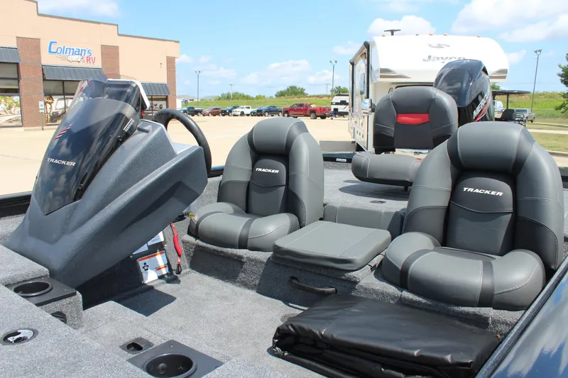 Slide: The Image of 2026 Tracker Pro Team 175 boat interior with gray seating and steering console. - 9