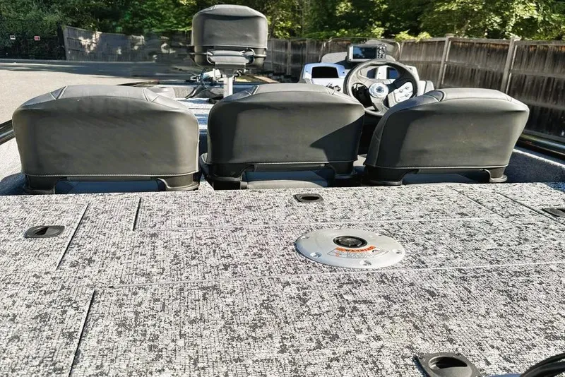 Slide: The Image of 2026 Tracker Pro Team 175 Crappie Edition boat interior with seating and steering wheel. - 7