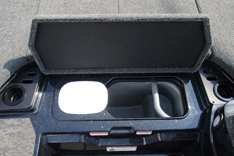 Slide: The Image of 2026 Nitro Z21 XL Pro boat storage compartment with open lid and cup holders. - 18