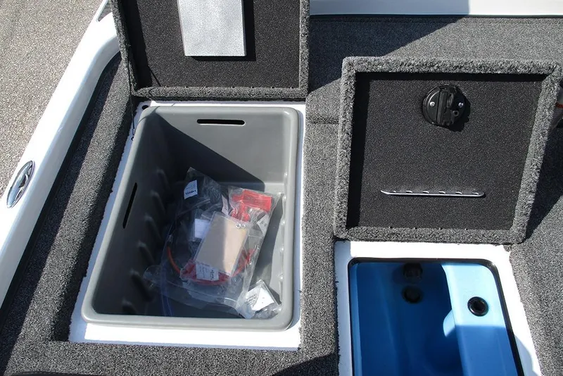 Slide: The Image of 2026 Nitro Z21 XL Pro boat storage compartments with open lids and visible contents. - 24