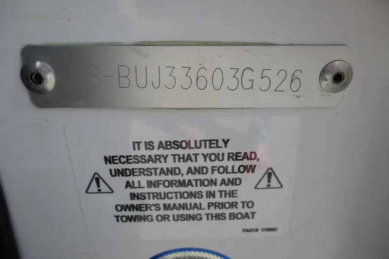 Slide: The Image of Hull identification number on a 2026 Nitro Z21 XL Pro boat with safety warning label. - 31