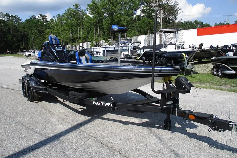 Slide: The Image of 2026 Nitro Z21 XL Pro boat on trailer, parked outdoors, showcasing sleek design. - 5