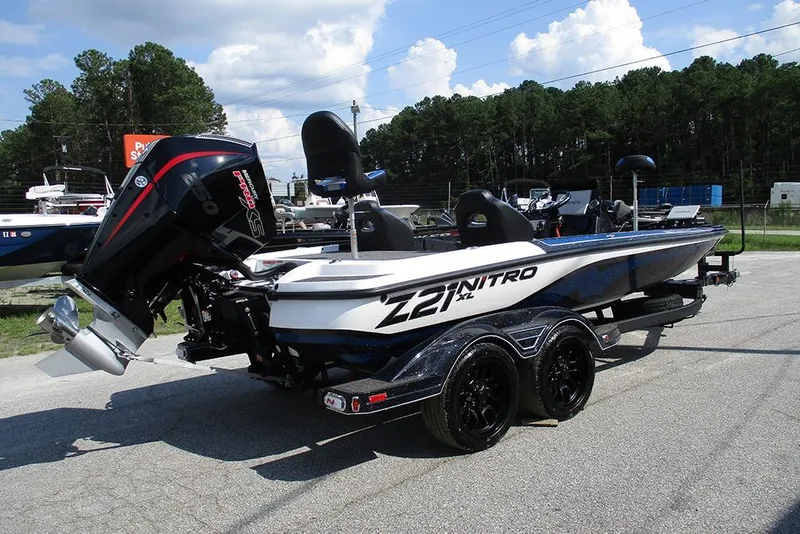 Slide: The Image of 2026 Nitro Z21 XL Pro boat with powerful outboard motor, parked on a trailer. - 7