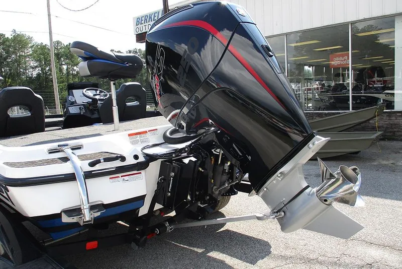 Slide: The Image of 2026 Nitro Z21 XL Pro boat with powerful outboard motor, parked outside dealership. - 8