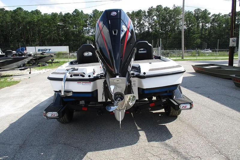 Slide: The Image of 2026 Nitro Z21 XL Pro boat rear view with powerful outboard motor. - 9