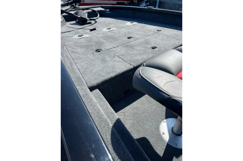 Slide: The Image of 2026 Tracker Pro Team 175 Crappie Edition boat interior with seating and storage compartments. - 3