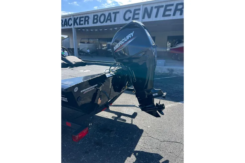 Slide: The Image of 2026 Tracker Pro Team 175 Crappie Edition boat with Mercury outboard motor at dealership. - 6