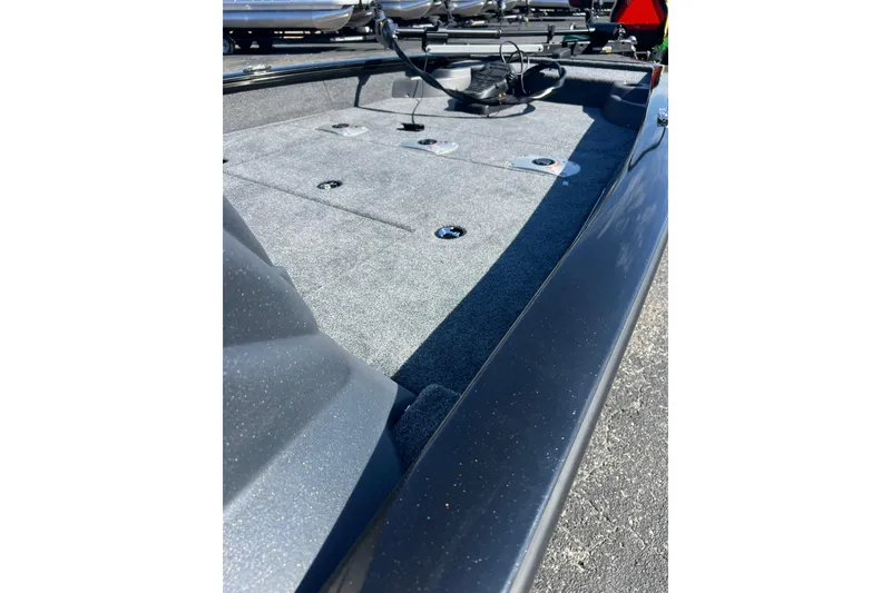 Slide: The Image of 2026 Tracker Pro Team 175 Crappie Edition boat deck with fishing rod holders. - 8