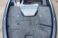 Slide: The Image of 2026 Phoenix 818 Pro boat interior with gray carpet and seating. - 4
