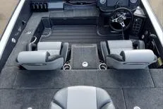 Slide: The Image of 2026 Phoenix 818 Pro boat interior with gray seating and steering console. - 8