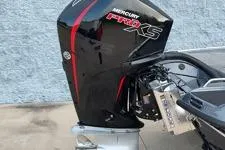 Slide: The Image of 2026 Phoenix 818 Pro boat with Mercury Pro XS outboard motor, side view. - 9