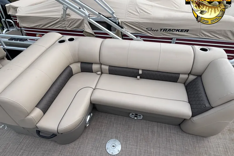Slide: The Image of 2023 Sun Tracker SportFish 20 DLX boat interior with beige and gray cushioned seating. - 8