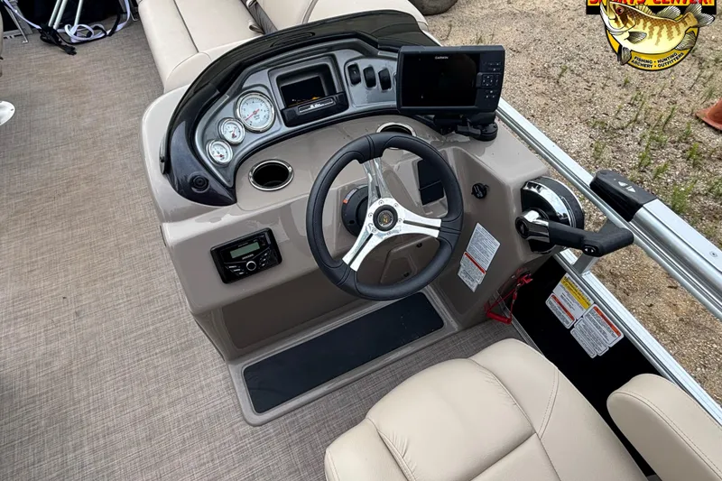 Slide: The Image of 2023 Sun Tracker SportFish 20 DLX boat dashboard with steering wheel and controls. - 9