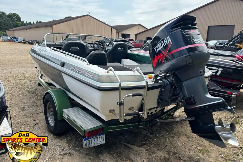 Slide: The Image of 2002 Skeeter SL 190 boat with Yamaha VMAX 150 engine on a trailer at D&R Sports Center. - 2