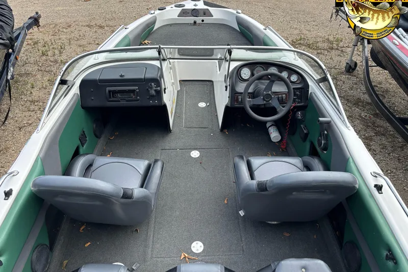 Slide: The Image of 2002 Skeeter SL 190 boat interior with steering wheel and seating arrangement. - 4