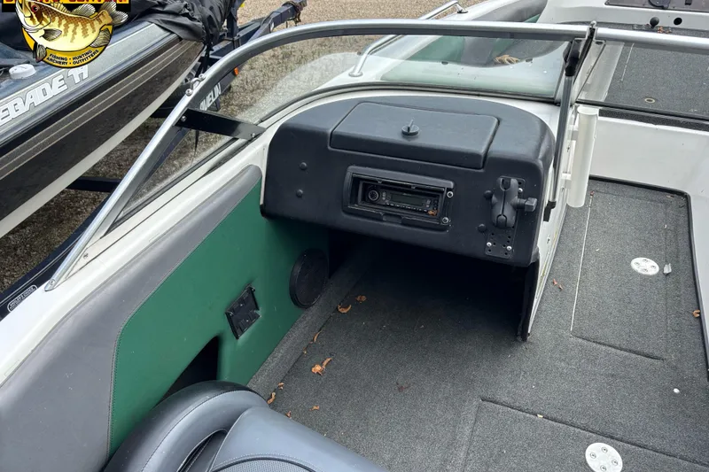 Slide: The Image of 2002 Skeeter SL 190 boat interior with dashboard and seating area. - 6