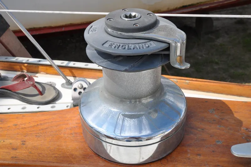 Slide: The Image of Sailing winch on 1984 Sabre 38 MKI yacht deck, with wooden finish and sandal nearby. - 12
