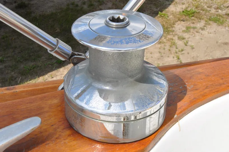 Slide: The Image of Chrome winch on 1984 Sabre 38 MKI sailboat, mounted on wooden deck. - 13