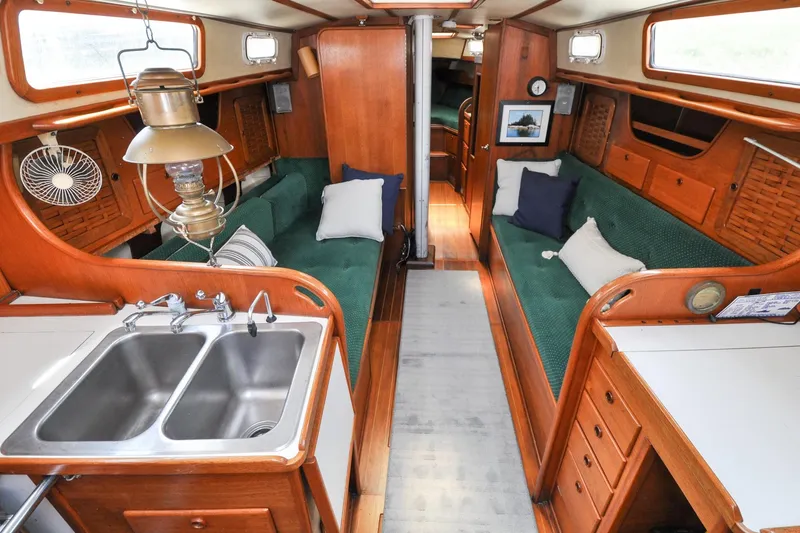 Slide: The Image of Interior of 1984 Sabre 38 MKI sailboat with wood finish and green seating. - 35