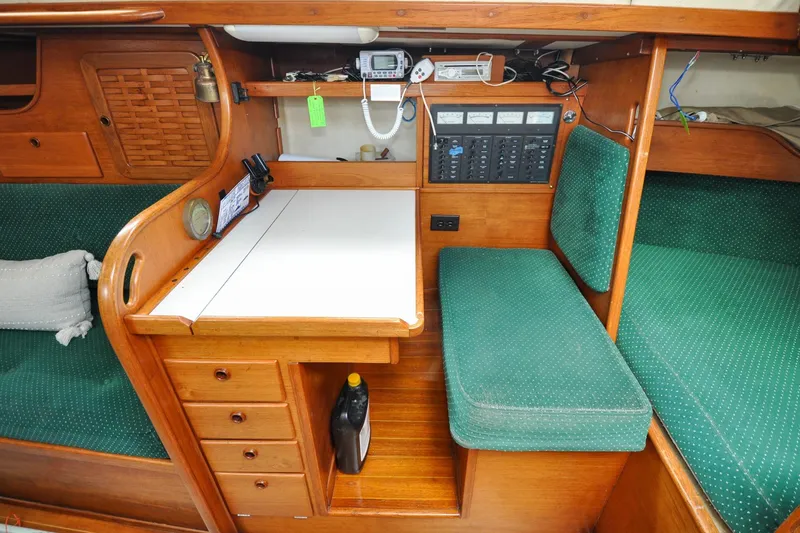 Slide: The Image of Interior of 1984 Sabre 38 MKI sailboat with navigation station and green upholstery. - 37