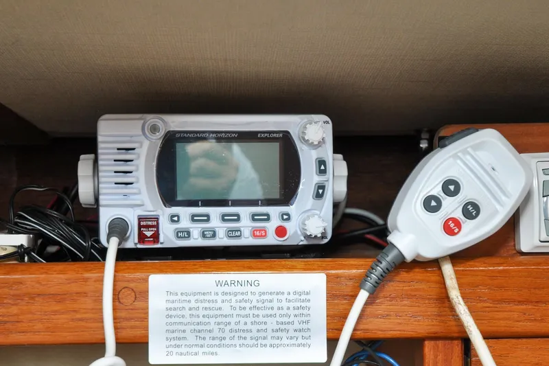 Slide: The Image of VHF marine radio equipment on 1984 Sabre 38 MKI sailboat, featuring distress signal functionality. - 40