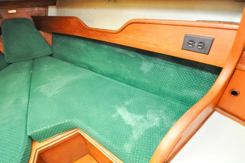 Slide: The Image of Interior cabin of 1984 Sabre 38 MKI sailboat with green upholstery and wooden trim. - 54