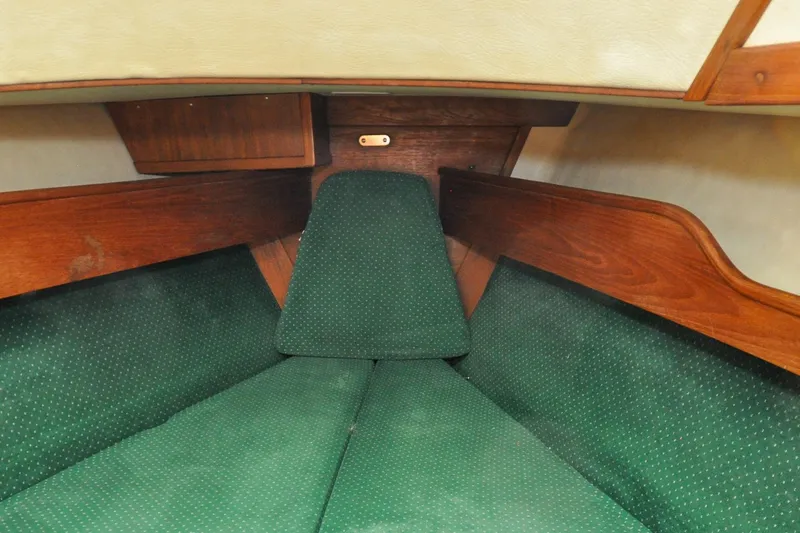 Slide: The Image of Interior cabin of 1984 Sabre 38 MKI sailboat with green upholstery and wooden accents. - 55