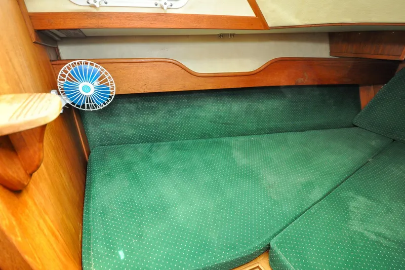 Slide: The Image of Interior cabin of 1984 Sabre 38 MKI sailboat with green upholstery and small fan. - 56