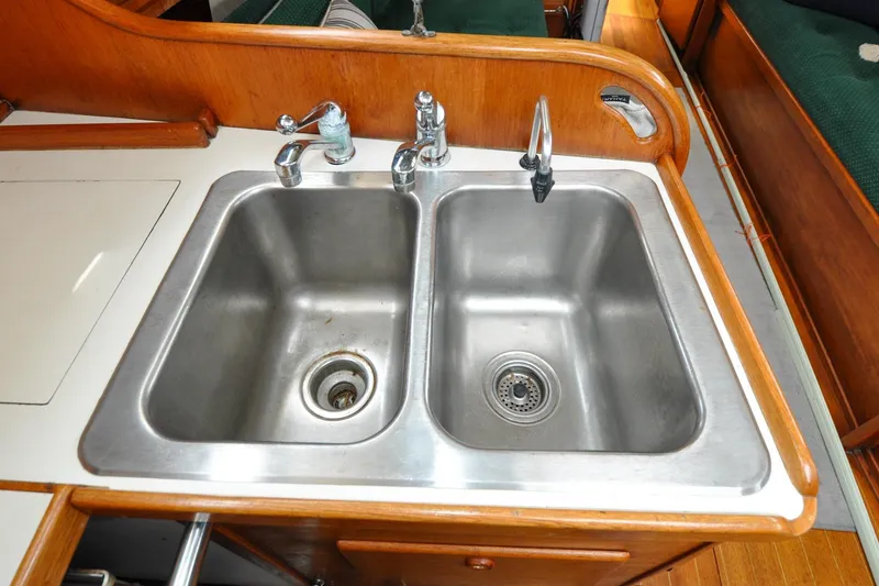 Slide: The Image of Stainless steel double sink in 1984 Sabre 38 MKI yacht galley. - 77