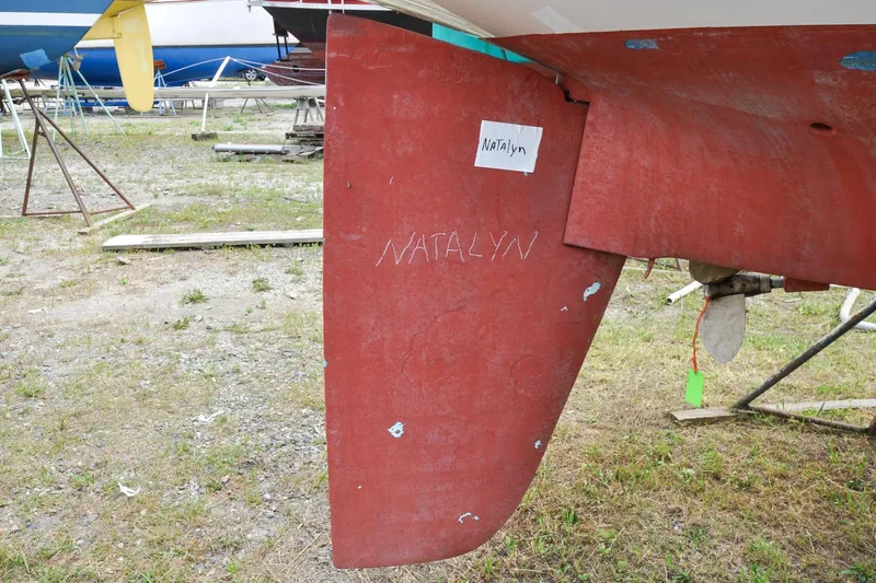 Slide: The Image of Red rudder of 1984 Sabre 38 MKI sailboat with "Natalyn" inscription. - 90