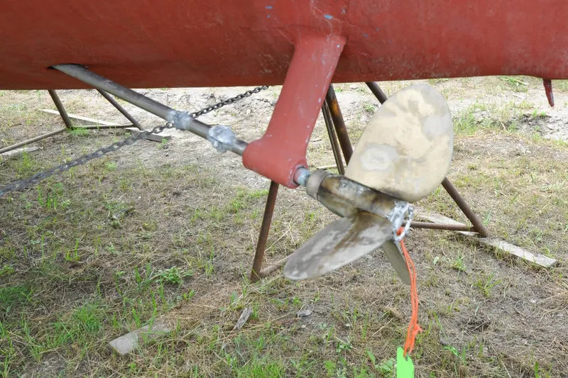 Slide: The Image of Propeller of 1984 Sabre 38 MKI sailboat on dry land, showing wear and rust. - 95
