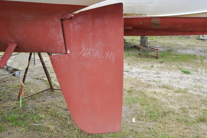Slide: The Image of Red rudder of 1984 Sabre 38 MKI sailboat with "Natalyn" written on it. - 97