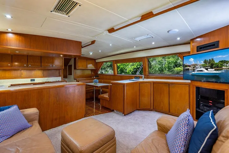 Slide: The Image of Luxurious interior of a 1998 Bertram Convertible yacht with wood finishes and modern amenities. - 32