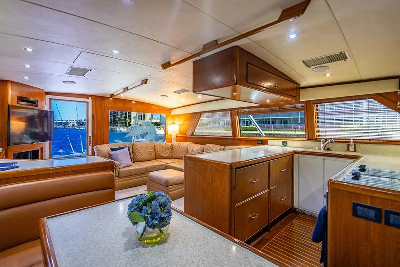 Slide: The Image of Luxurious interior of a 1998 Bertram Convertible yacht with elegant wood finishes. - 38