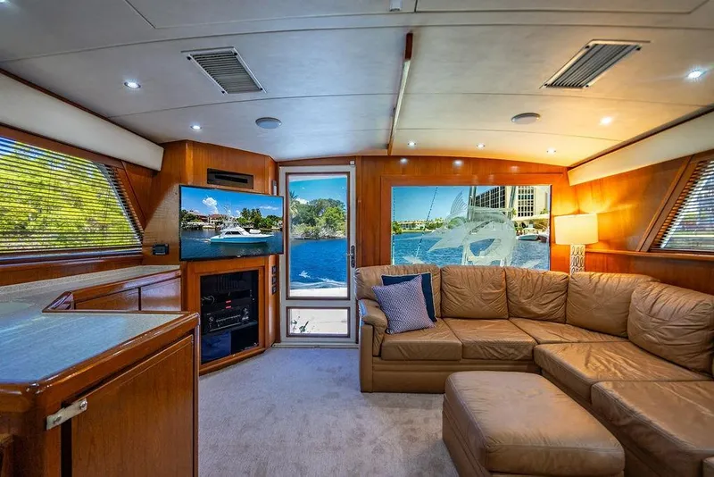 Slide: The Image of Luxurious interior of a 1998 Bertram Convertible yacht with leather seating and scenic views. - 41