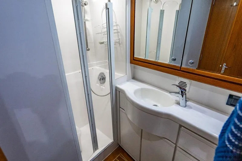 Slide: The Image of Bathroom interior of 1998 Bertram Convertible yacht with shower and sink. - 45