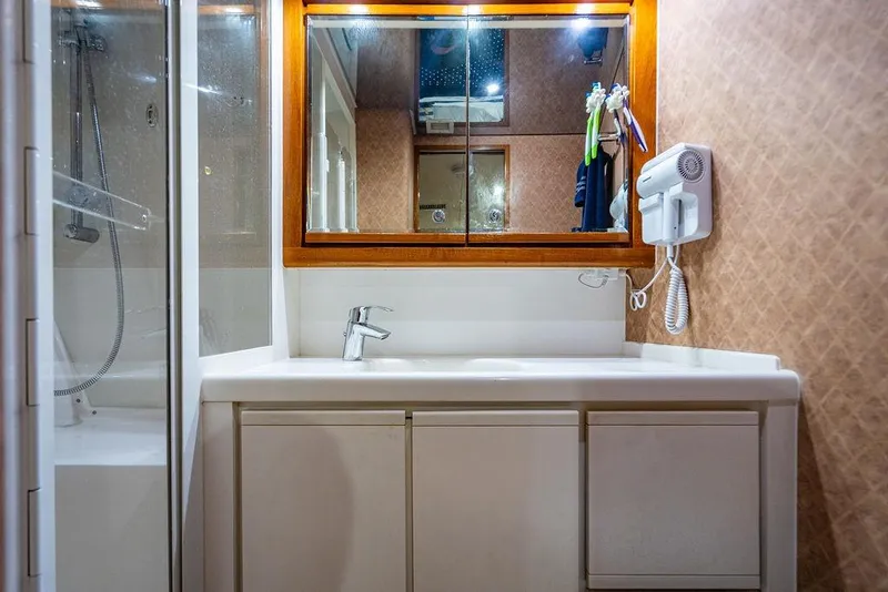 Slide: The Image of Bathroom interior of 1998 Bertram Convertible yacht with shower and vanity. - 66