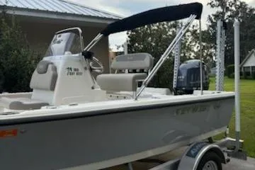 Slide: The Image of 2009 Key West 188 Bay Reef boat with canopy on trailer, parked outdoors. - 3