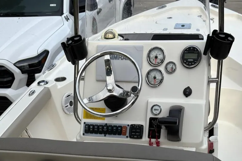 Slide: The Image of 2024 Key West 188 Bay Reef boat dashboard with steering wheel and gauges. - 6