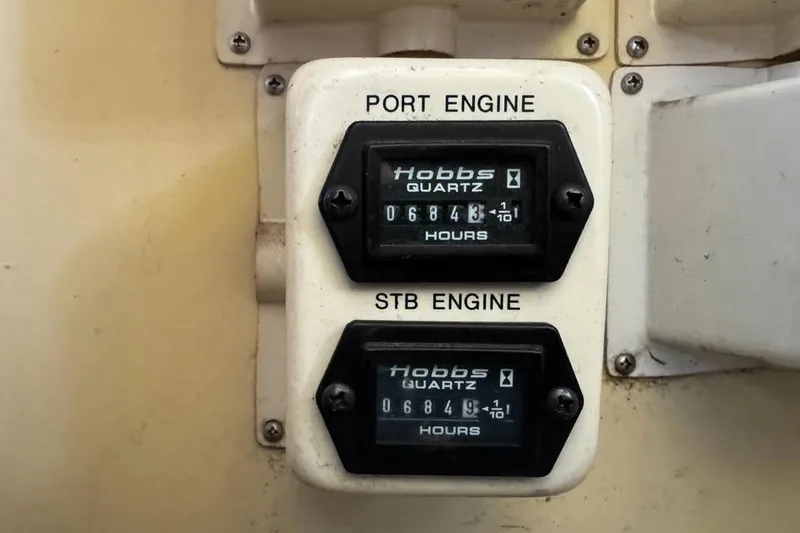 Slide: The Image of Hour meters for port and starboard engines on a 1994 Chris-Craft 322 Crowne boat. - 7