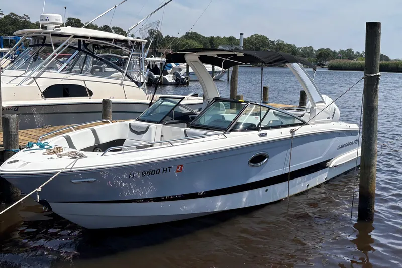 The Image of 2024 Chaparral 270 OSX boat docked on a sunny day, showcasing sleek design. - 1