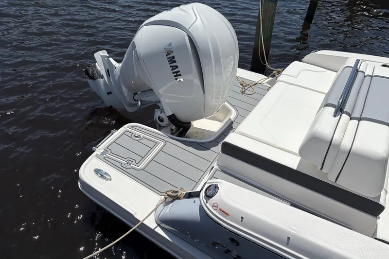 Slide: The Image of 2024 Chaparral 270 OSX boat with Yamaha outboard engine on water. - 3