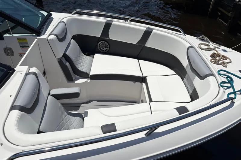 Slide: The Image of 2024 Chaparral 270 OSX boat interior with luxurious seating and modern design. - 4