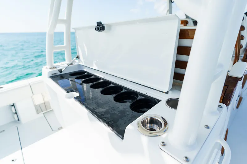 Slide: The Image of 2021 Barker Boatworks 40 HPC fishing station with cup holders on deck. - 20