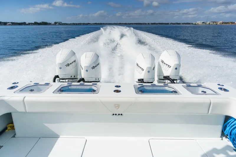 Slide: The Image of Barker Boatworks 40 HPC 2021 with powerful outboard engines cruising on open water. - 21