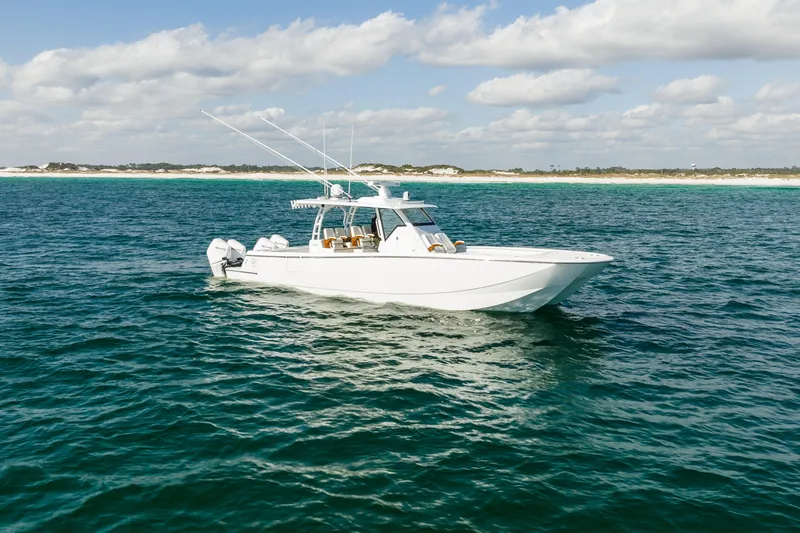 Slide: The Image of 2021 Barker Boatworks 40 HPC cruising on open water under a partly cloudy sky. - 3