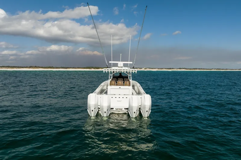 Slide: The Image of 2021 Barker Boatworks 40 HPC on open water, showcasing powerful engines and sleek design. - 6