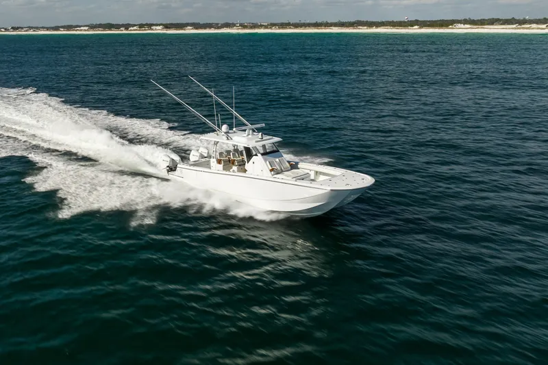 Slide: The Image of 2021 Barker Boatworks 40 HPC cruising on open water, showcasing speed and elegance. - 8