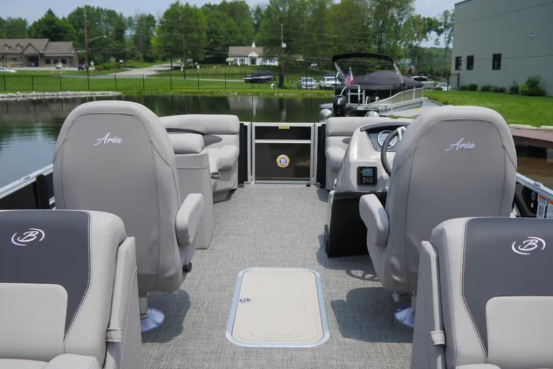 Slide: The Image of 2025 Barletta ARIA 22QC pontoon boat interior with plush seating and modern design. - 4