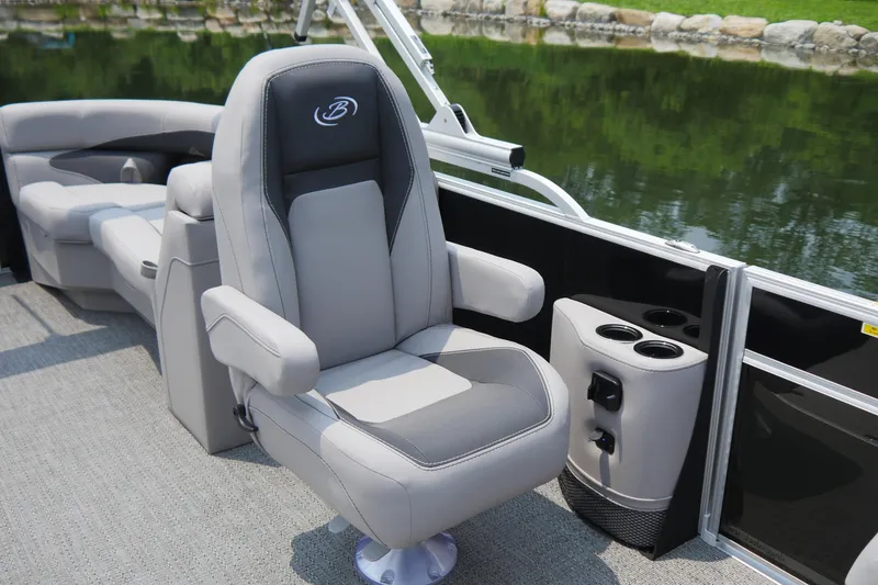 Slide: The Image of 2025 Barletta ARIA 22QC boat interior with plush seating and cup holders. - 7